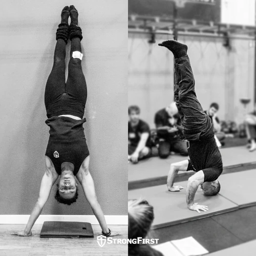 A woman does a wall-assisted handstand while a man does a headstand.