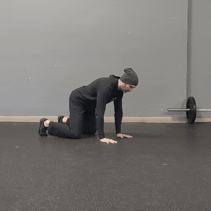 Coach Ryan demonstrates forward and backward crawling.