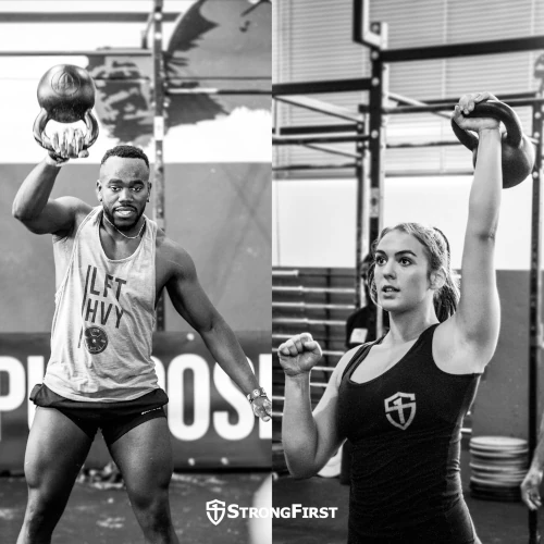 A man does kettlebell snatches while a woman does a kettlebell military press.