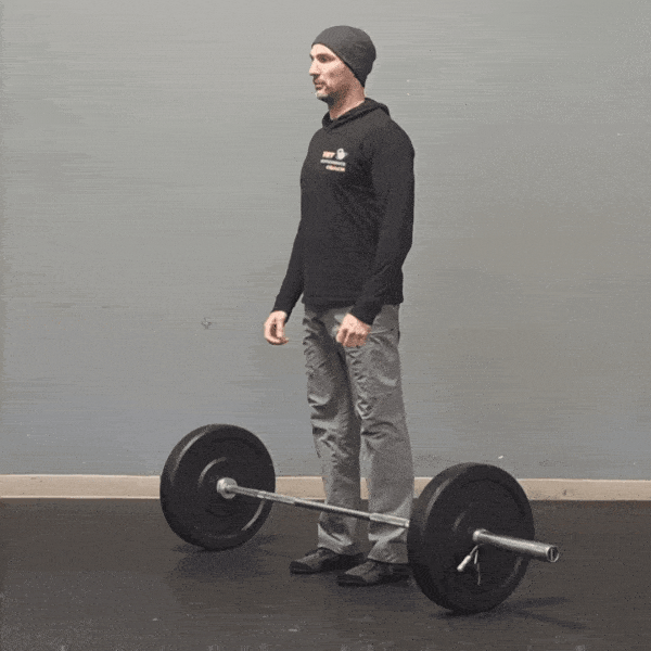 Coach Ryan demonstrates Zercher squats.